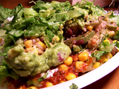 I love the guacamole, spicy red tomatillo salsa, and sweet corn together. Yum.